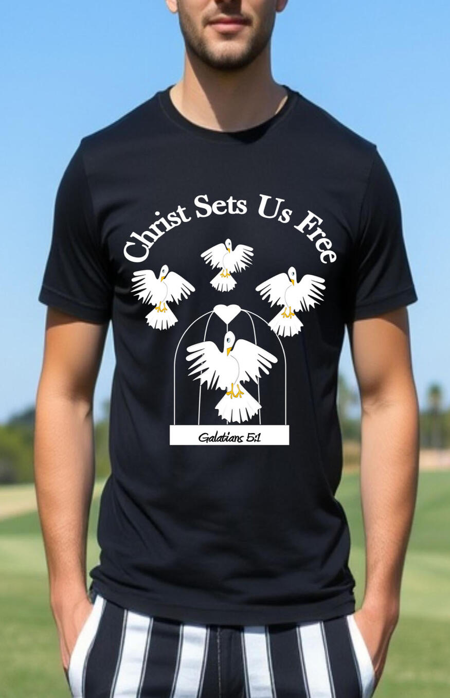 Christ Sets Us Free Men's Christian T-shirt. Featuring White doves flying above a cage with a heart.